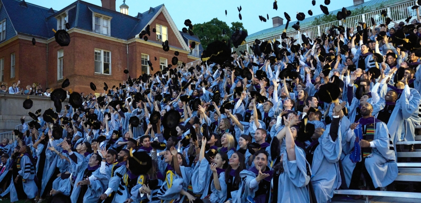 Columbia Law graduates toss their velvet tams in the air
