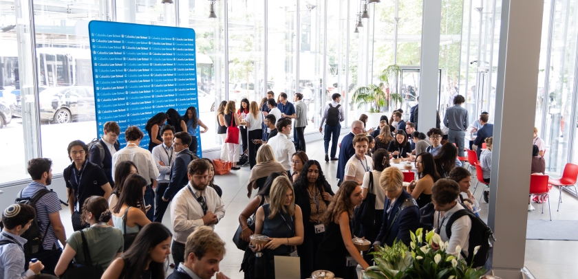 Crowd of students mingling over breakfast 