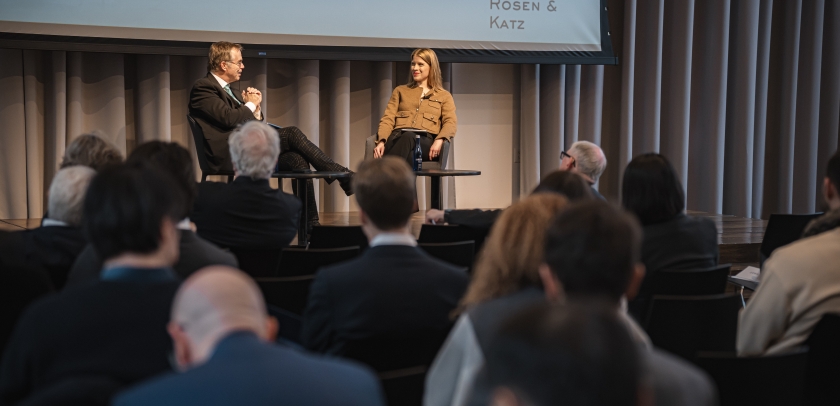 Man and woman onstage in conversation with audience.
