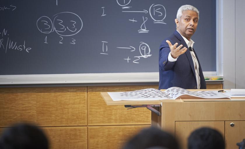 Professor Zohar Goshen teaching in front of a blackboard