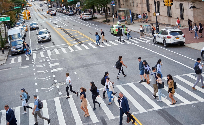 Student cross Amsterdam Avenue at the crosswalk.