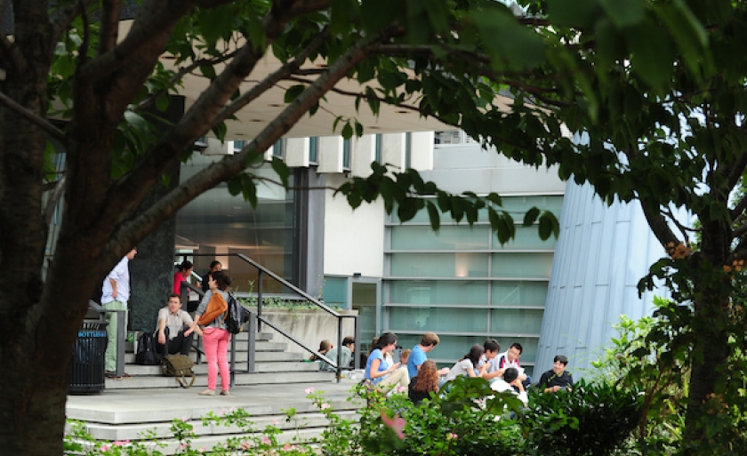 Students sitting on stairs outside the Law School