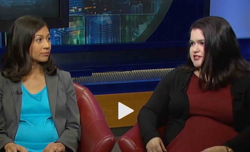 Professor Elora Mukherjee and student Angelica Juarbe sit in chairs in an interview. The news chyron at the bottom of the scream reads Defending Illegal Aliens.