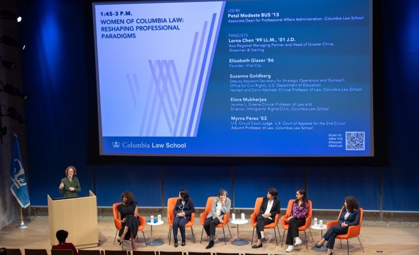 Five panelists since on a stage for Women of Columbia Law's Forum at the Forum event.