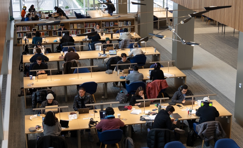 Looking down at students sitting at long tables