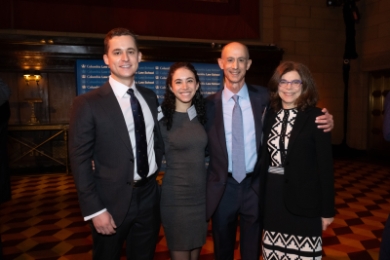 Family group of parents and adult children in business attire