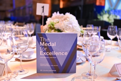 "Medal For Excellence" program on lunch table