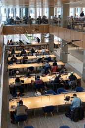 Looking down at students sitting at long tables