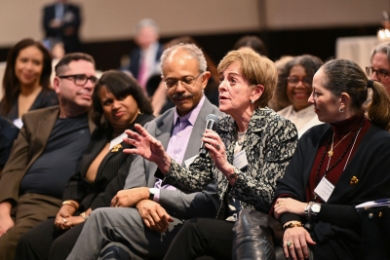A woman in the audience asks a question at the Columbia Law Alumni of Color Reception
