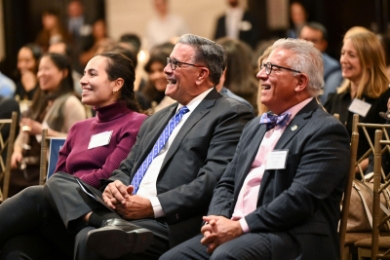 Rolando Acosta with his daughter and another man at Columbia Law Alumni of Color event