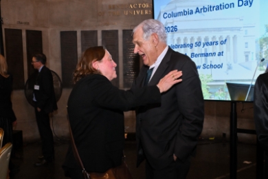 Professor Jane Ginsburg puts her hand on the shoulder of Professor George Bermann