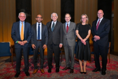 Merritt Fox, Daniel Abebe, George Bermann, Michael Doyle, Anu Bradford, and Robert Smit standing in a row at Arbitration Day