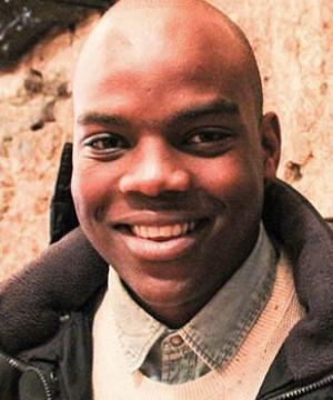 Portrait of Kevin Minofu ‘18 LL.M. smiling in business attire