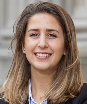 Portrait of María Dinard ’18 LL.M. smiling in business attire