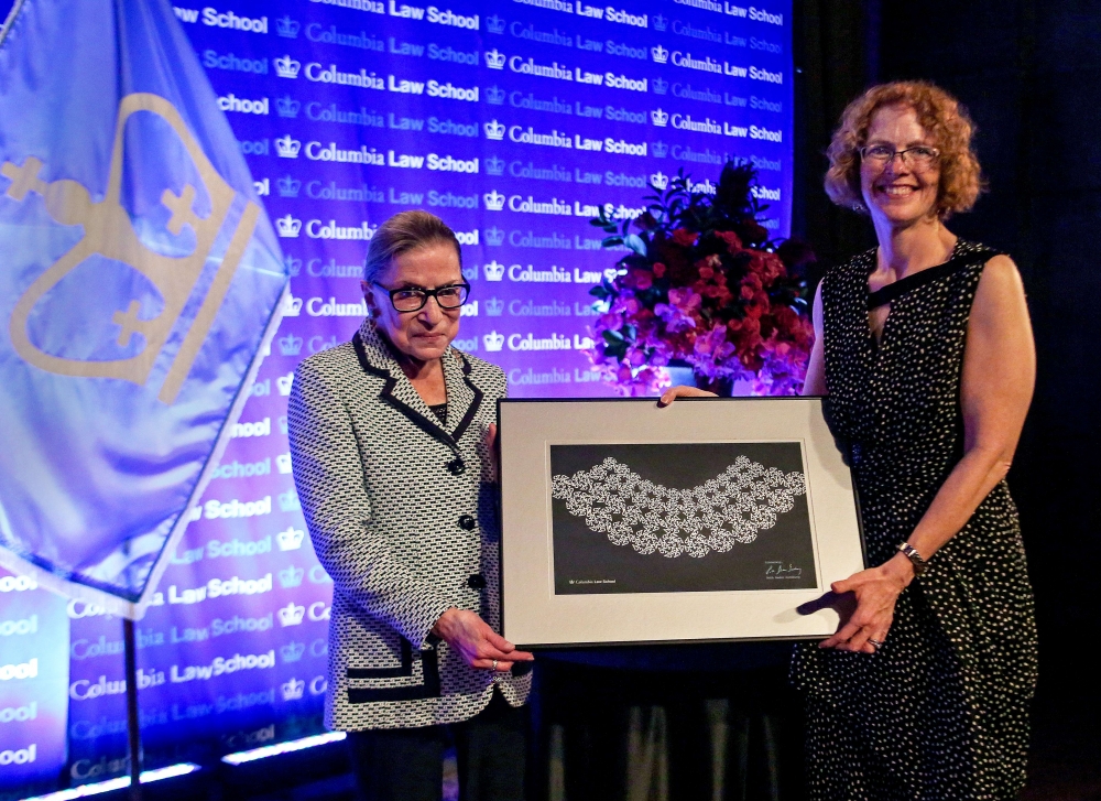 Dean Gillian Lester presents Ruth Bader Ginsburg with a custom made lace collar.