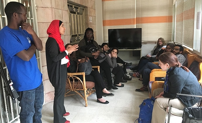 Columbia Law students on a spring break caravan in Amman, Jordan, meet members of Jesuit Refugee Service, which provides opportunities for refugees to study English and obtain higher education diplomas, among other services. 