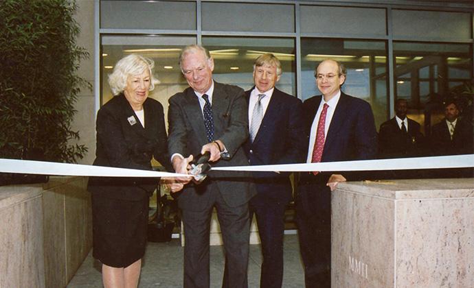 Gerry and Marguerite Lenfest cut a white ribbon in front of the entrance of Lenfest Hall.