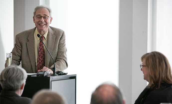 Liebman regales guests at his retirement luncheon.