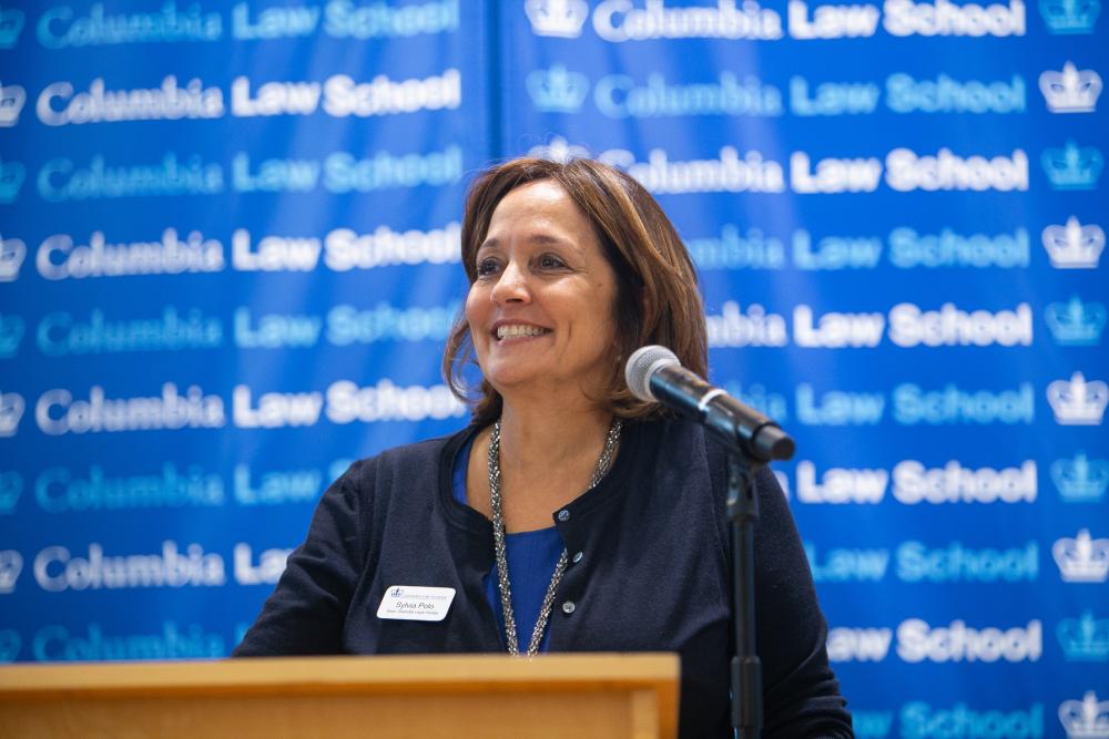 Sylvia Polo speaks at a podium.