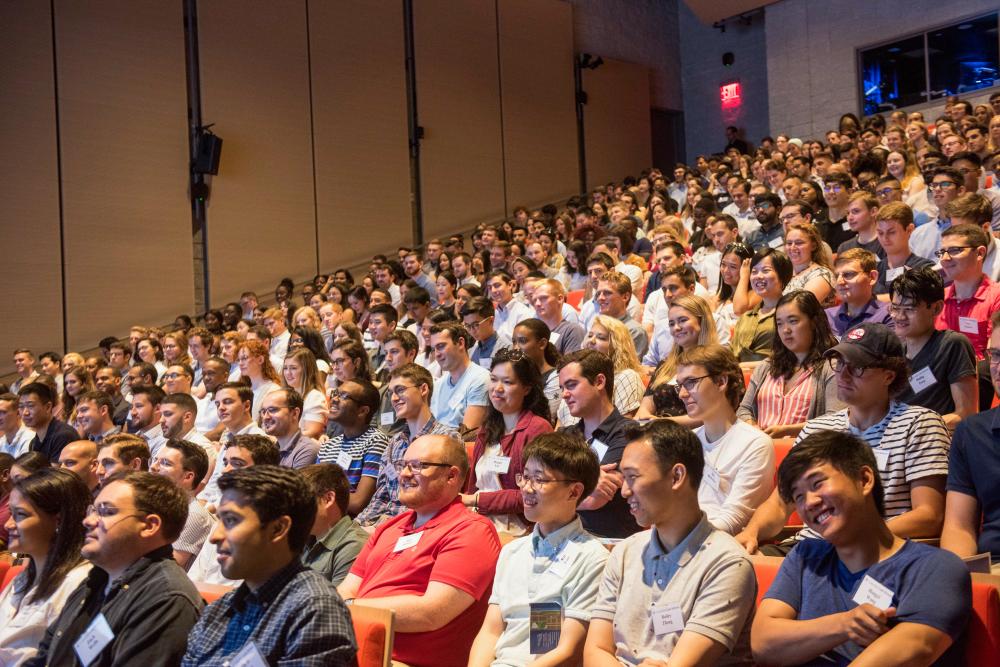 Students sit in an auditorium