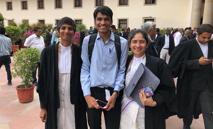 Menaka Guruswamy, Kumar Vardhman (petitioner), and Arundhati Katju ’17 LL.M. before oral arguments in July.