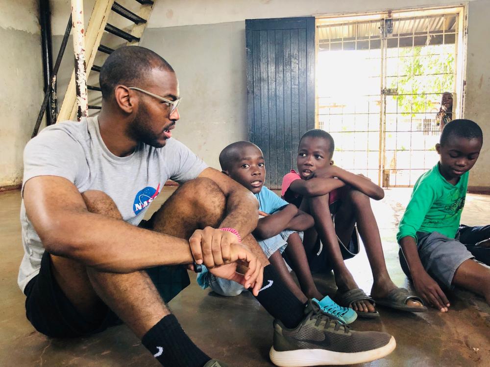 Frank Williams '20 with children in the after-school Holiday Club.