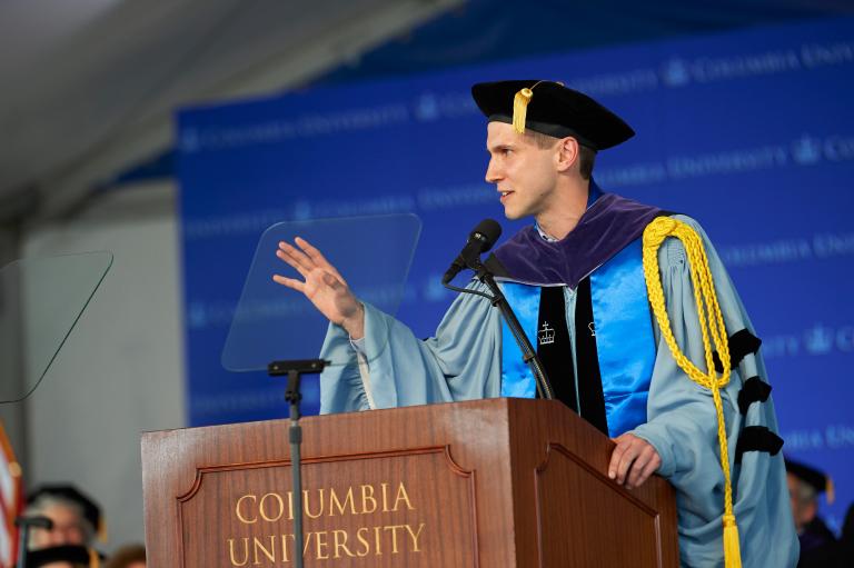 Jonas Vernimmen ’19 LL.M. speaks at a podiun