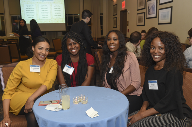 Students sit at a table at the 2019 Public Interest Honors Dinner.
