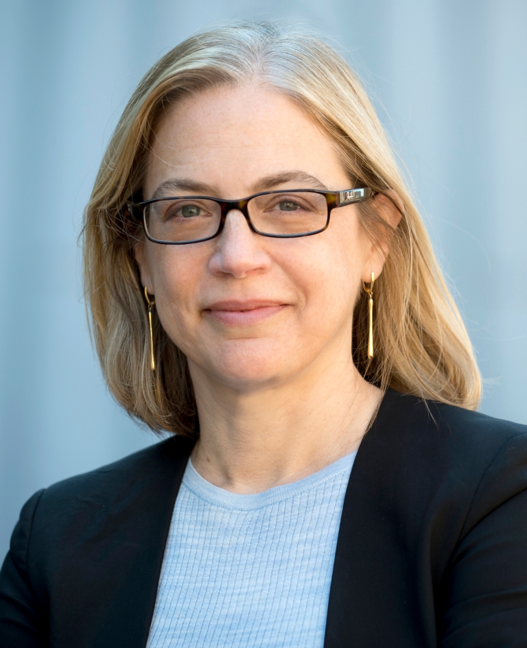 Columbia Law Professor Gillian Metzger in glasses and light blue sweater and dark blazer