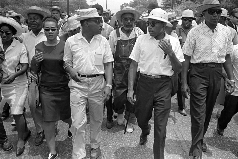 two men lead a march 