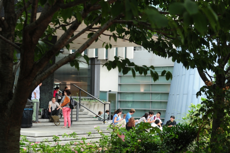 Students sitting on stairs outside the Law School