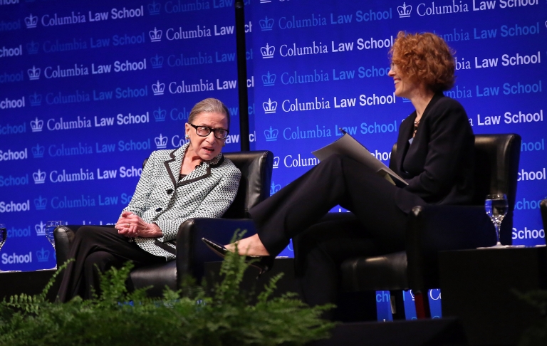 Columbia Law School Dean Gillian Lester sitting next to Justice Ruth Bader Ginsburg ’59