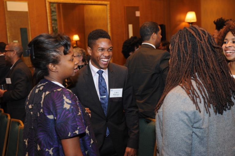 Attendees socialize at the 2016 Alumni of Color reception