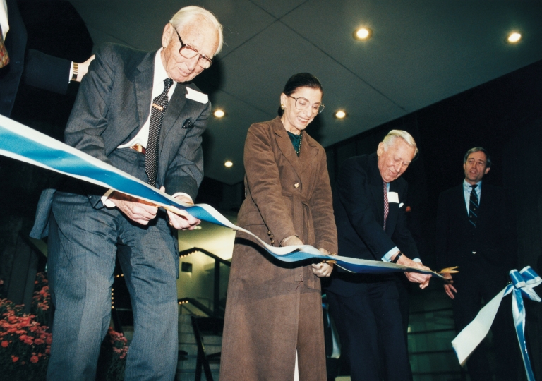 Jerome L. Greene ’28 (second from right) at the 1999 Jerome Greene Hall ribbon-cutting ceremony with former Dean William C. Warren (left) and U.S. Supreme Court Justice Ruth Bader Ginsburg '59 (center).
