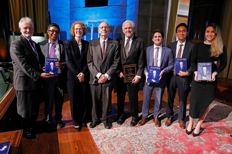 A group of people holding books