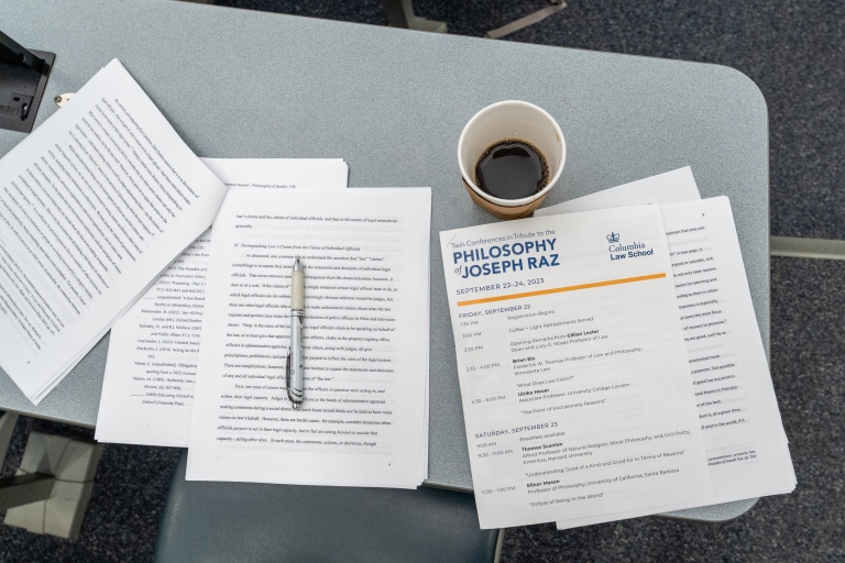 Papers and a cup of coffee on a desk