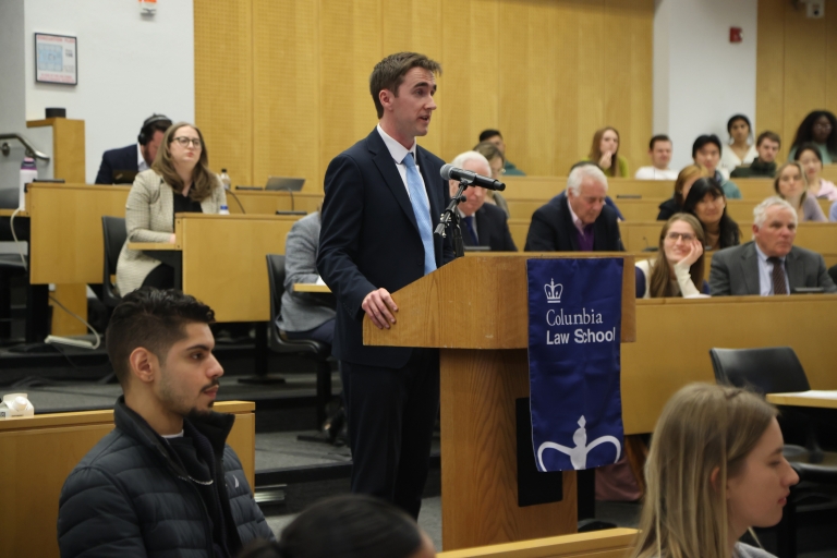 Man stands at a podium