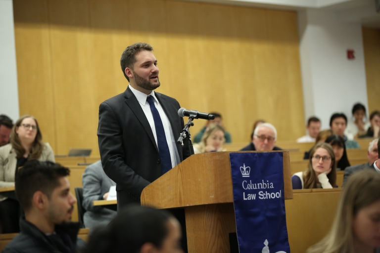 Man stands at a podium