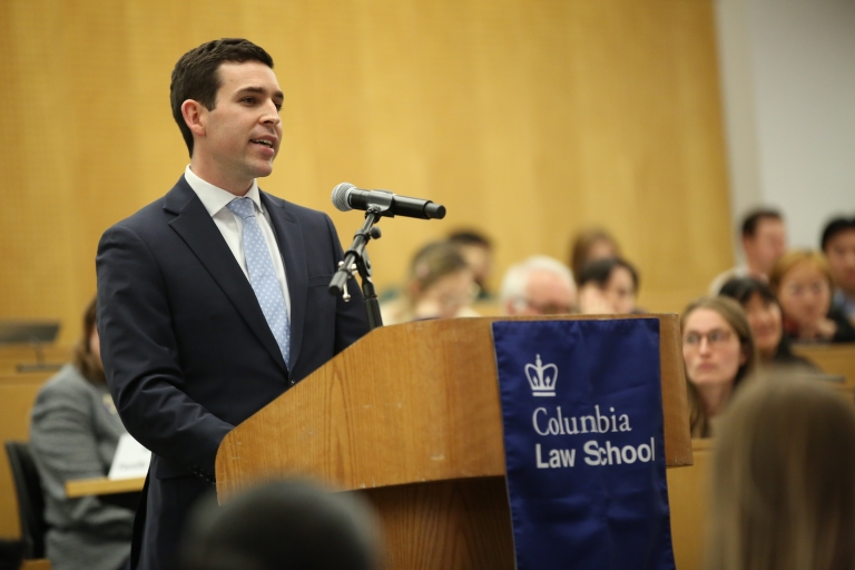 Man stands at a podium