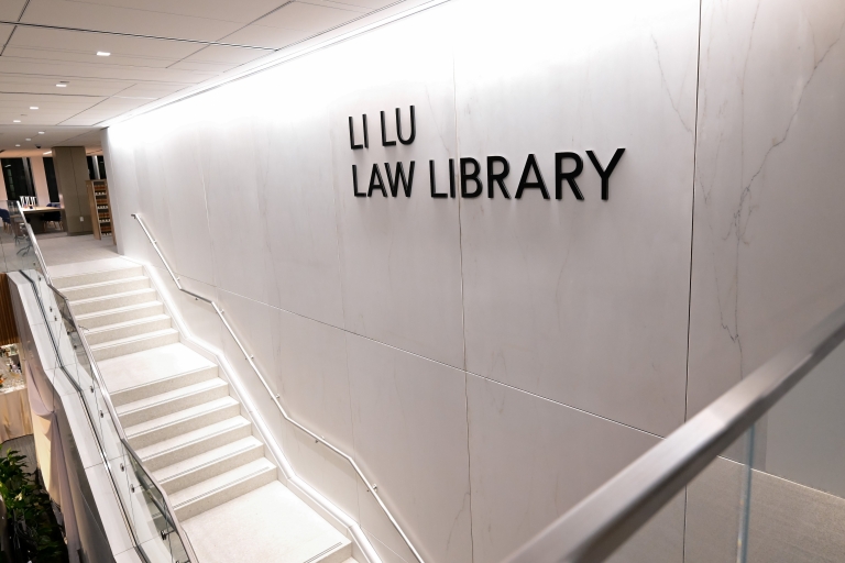 Staircase under "Li Lu Law Library" signage