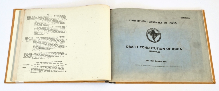 Open book showing first page of Draft Constitution of India