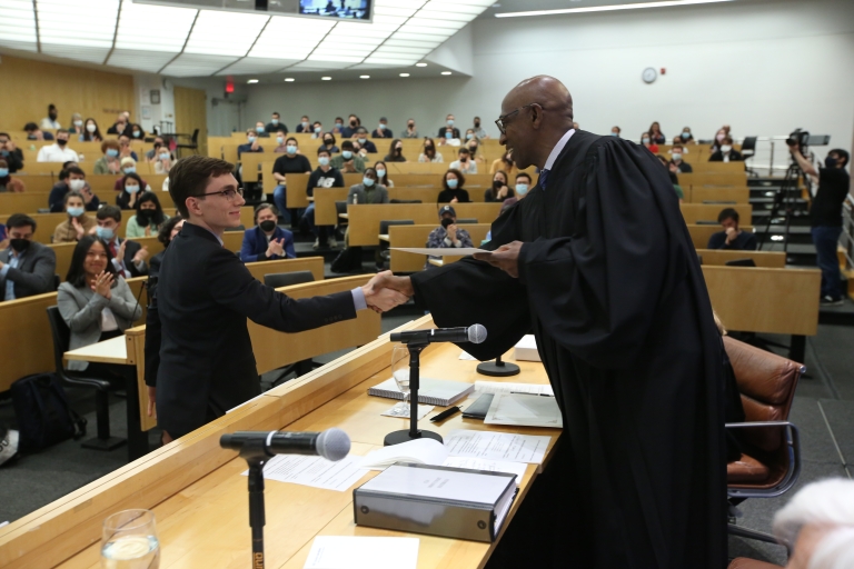 2022 Stone Moot Court Finalist Nino Dickersin ’23 shakes hands with Judge Joseph A. Greenaway Jr