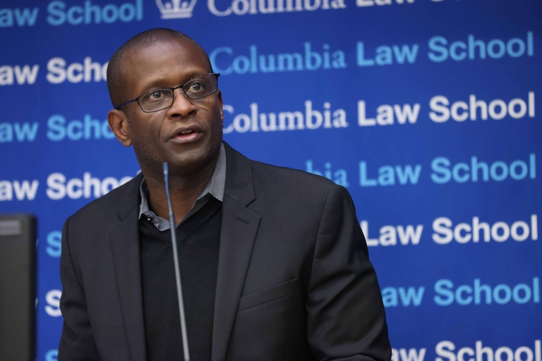 Professor Jamal Greene speaks at a podium.