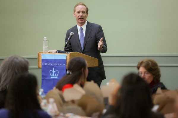 Brad Smith speaks at a podium at the 2015 clinics celebration.