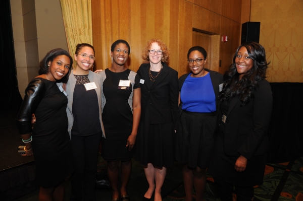 Dean Lester poses with attendees at the Alumni of Color reception
