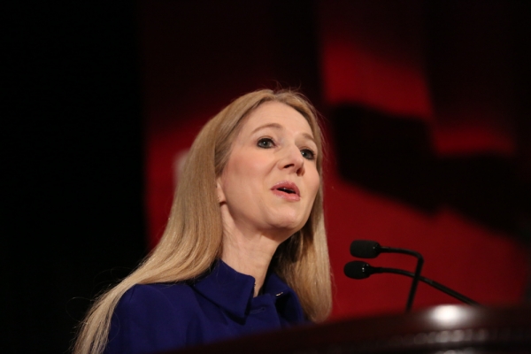 Columbia Law School Association President Laurie Magid ’85 speaks at a microphone