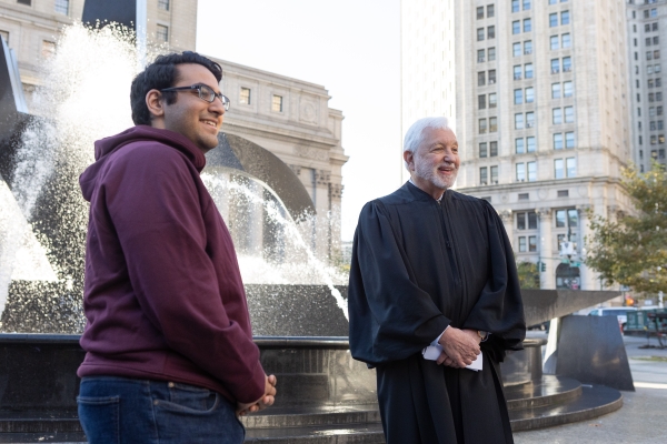 Harmukh Singh ’24, left, stands next to Judge Jed Rakoff  in front of the Thurgood Marshall United States Courthouse.
