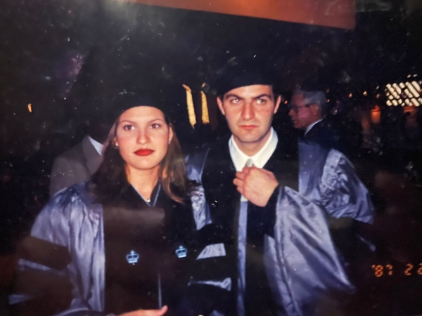 Couple in purple gowns at graduation