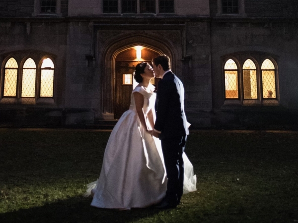 Bridee and groom kissing at twilight