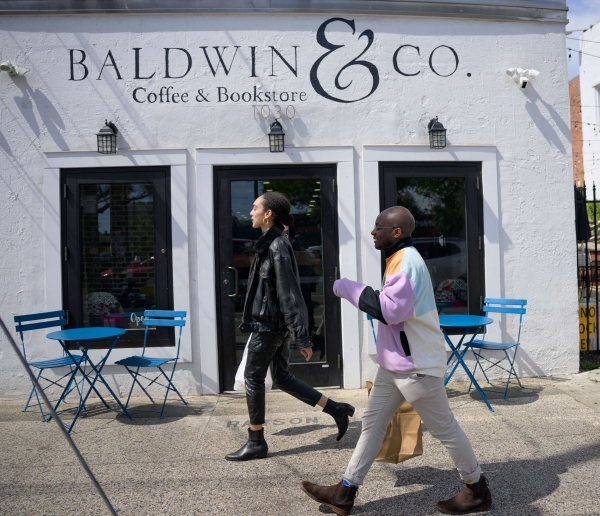 Students walking past a coffee shop